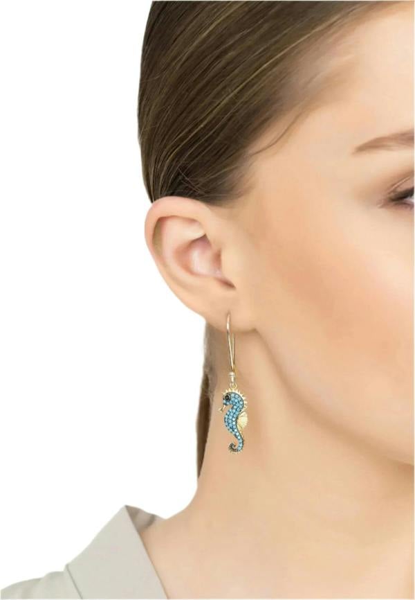 The earring worn by a model.