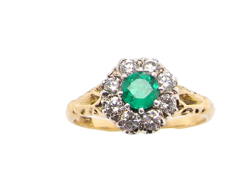 A vintage Emerald and Diamond cluster ring