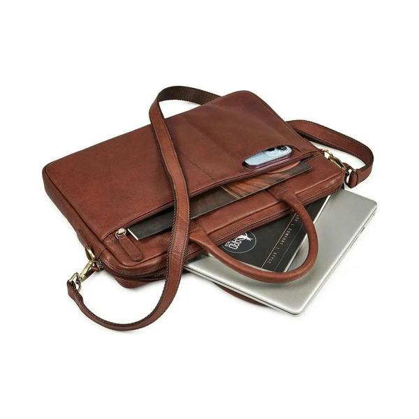 Brown leather briefcase with a laptop on a white background