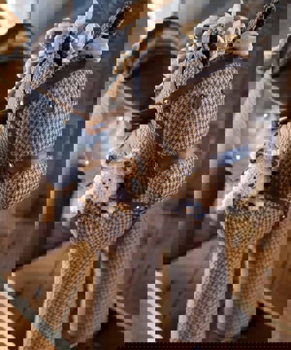 Close up of traditional Chester & Fred Rocking Horse with brown leatherette bridle and saddle