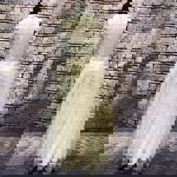 ivory coloured party dress on mannequin