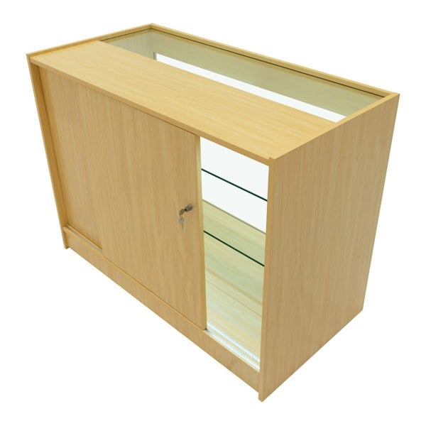 LED retail shop counter K1200 in maple finish, featuring a sleek design, glass shelves, and a secure sliding door for display storage