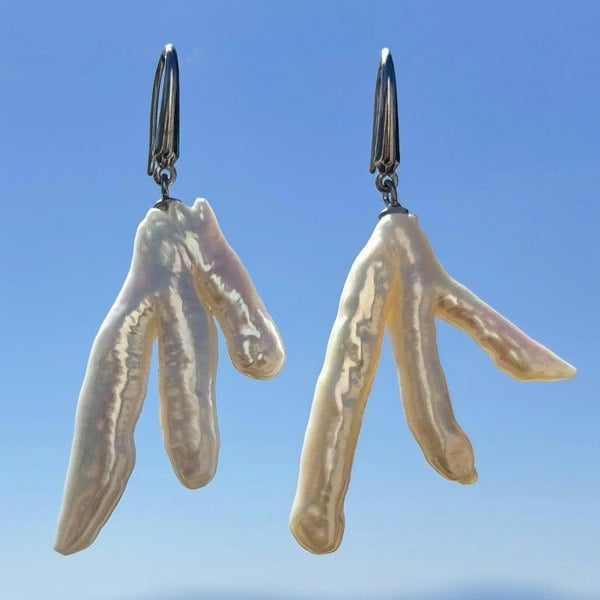 Irregular baroque pearl earrings in sterling silver by LENAE, asymmetrical design.