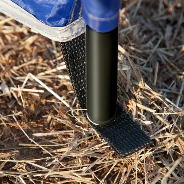 Steel pole base inserted into the windbreak fabric on dry ground