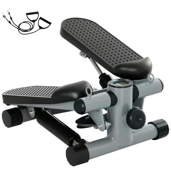 Grey compact mini stepper with black non-slip pedals and LCD monitor, includes resistance bands