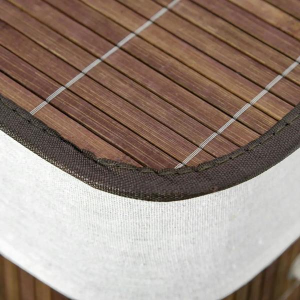 Close-up of brown hamper rim and white liner edge with reinforced stitched trim.