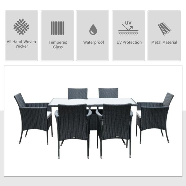 Black rattan dining set showing 6 cushioned armchairs and glass-top table
