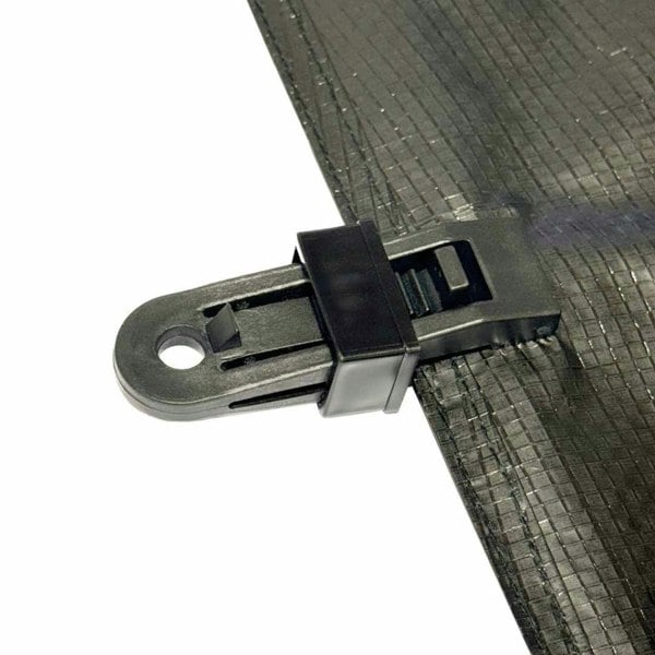 Illustration of a OLPRO Tent Groundsheet Pegging Clamp attached to a groundsheet, demonstrating one of its numerous applications. Available in a pack of four.