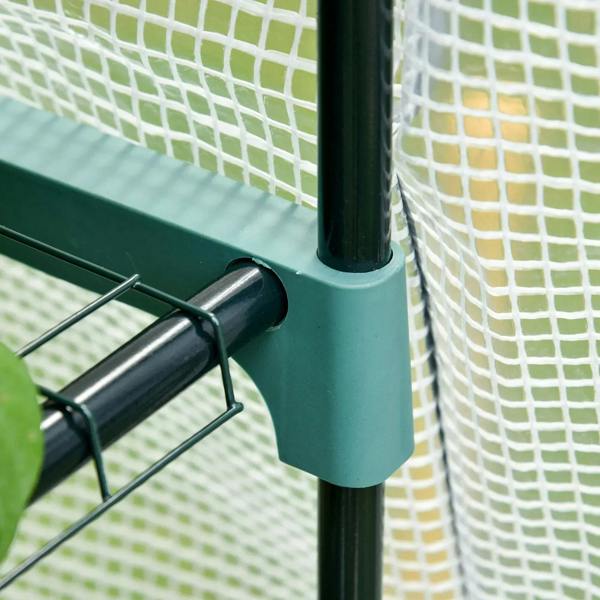Close-up of teal metal corner support on a greenhouse frame with white mesh cover