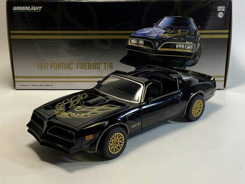 a black toy car with gold rims
