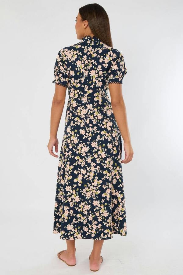 Woman wearing a floral dress on a white background