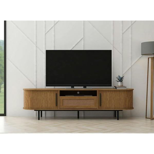 The TV cabinet in a modernly decorated living room. It shows the 2 cupboards, internal drawer and 1 shelf in use with a TV on top.