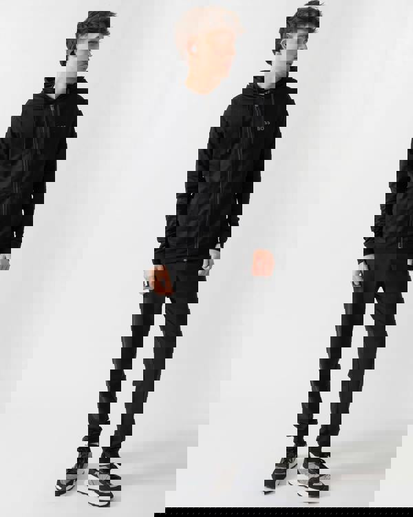 full length shot of a model wearing a BOSS Orange Mens Authentic Zip Up Loungewear Hoodie in Black 004