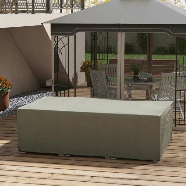 Grey waterproof furniture cover over outdoor seating on wooden deck