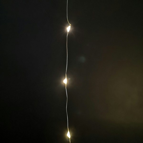 Samuel Alexander 100 LED 5m Premier MicroBrights Indoor Outdoor Christmas Multi Function Battery Operated Lights with Timer on Pin Wire in Warm White