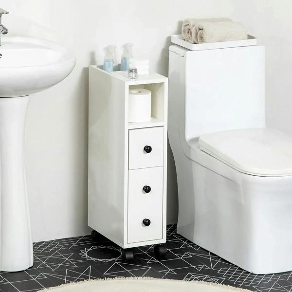White narrow bathroom storage cabinet with three drawer fronts and caster wheels