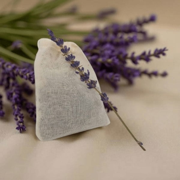 Textured pouch with lavender sprig on a beige background