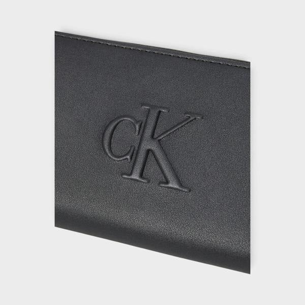 Supplied Fashion Calvin Klein black leather zip-around wallet featuring a debossed CK logo detail