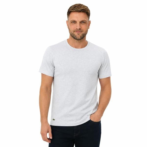 Man wearing a Lacoste silver chine cotton lounge t-shirt with a small crocodile logo.