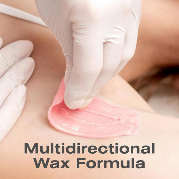 A gloved hand peels Rio Rose Go Smooth Stripless Hard Wax Beads (100g) from skin, revealing smooth results. The text Multidirectional Wax Formula appears at the bottom of the image.