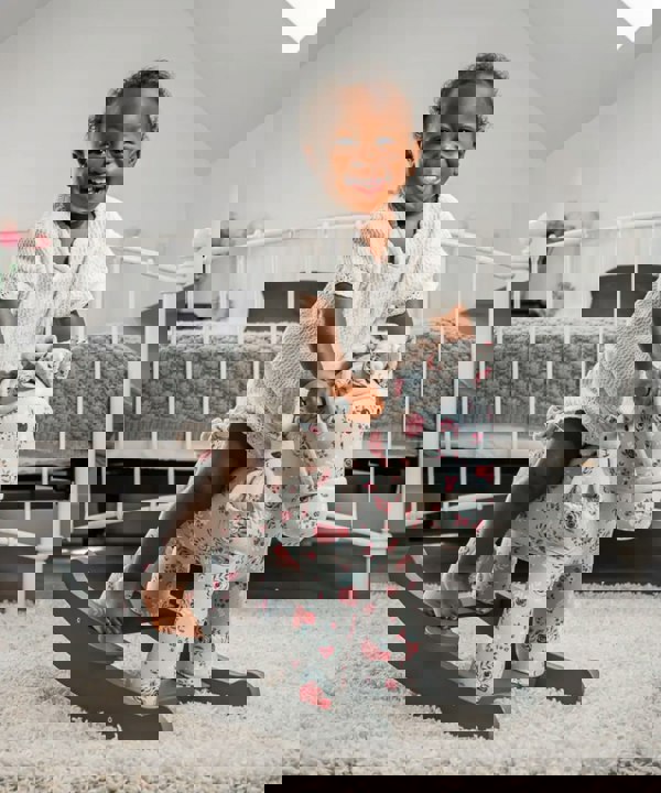 little girl rocking on Lily & Rose baby rocker