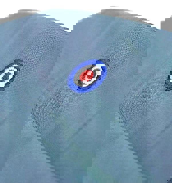 Lambretta Mens Showerproof Classic Harrington MOD Scooter Jacket Coat, close-up of light blue fabric with an embroidered roundel logo featuring a red center, white ring, and blue outer ring.