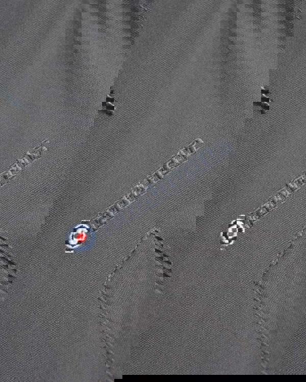 Lambretta Mens/Womens Carnaby Scooter Hooded Classic Mod Ska Badge Parka, close-up of the grey fabric with embroidered Lambretta logo and a circular badge.