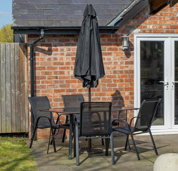 Samuel Alexander Outdoor 4 Person Rectangular Glass Top Garden Dining Table Chairs With Black Parasol and Base Set