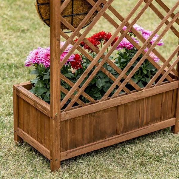 Brown wooden raised planter with lattice trellis and colorful flowers in bed