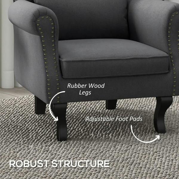 Dark grey Chesterfield-style accent chair with studded arms, curved legs, and foot pads