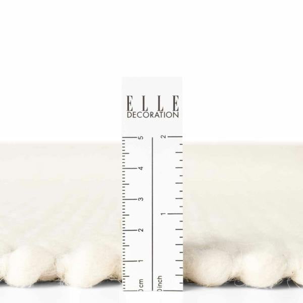 Measurement chart with ruler and 'ELLE DECORATION' branding on a white background