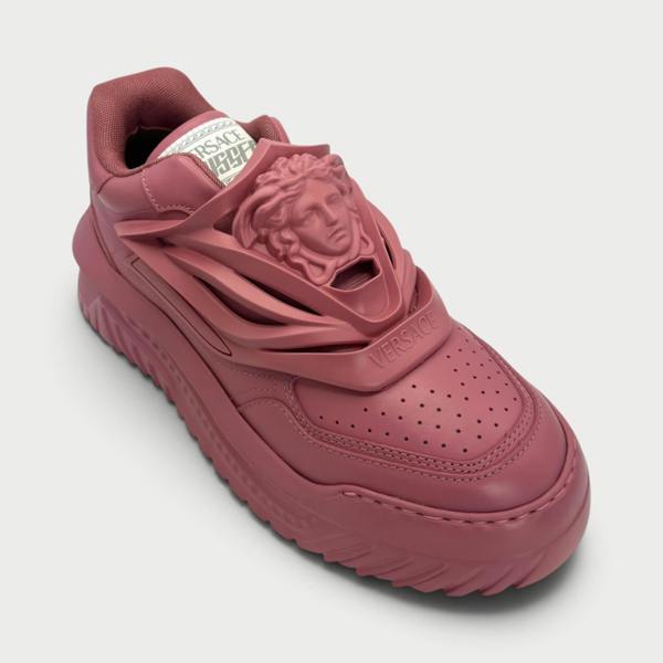 Supplied Fashion Versace Odissea sneakers in jam red featuring a prominent Medusa head motif and chunky rubber sole.