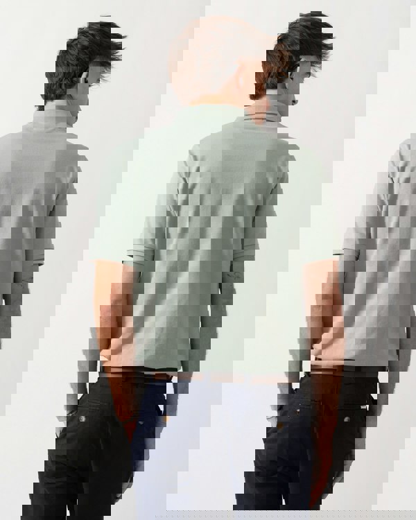 back shot of a Model wearing a GANT Mens Regular Fit Short Sleeve Shield Logo Pique Polo in Ceramic Grey