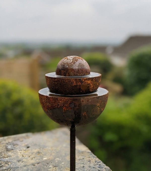 rusty garden ball fountain