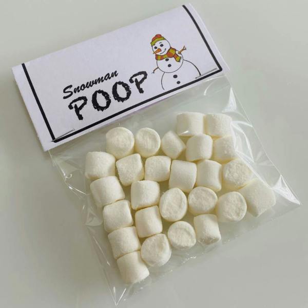 A clear bag filled with white mini marshmallows topped with a paper label reading Snowman Poop with a cartoon snowman.