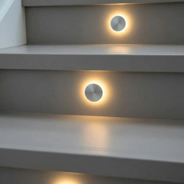 silver staircase tread lighting installed on a modern staircase riser