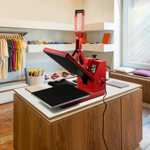 PixMax T-Shirt Sublimation Heat Press Machine in vibrant red, featuring a 38cm x 38cm clam design, set on a wooden table in a bright studio