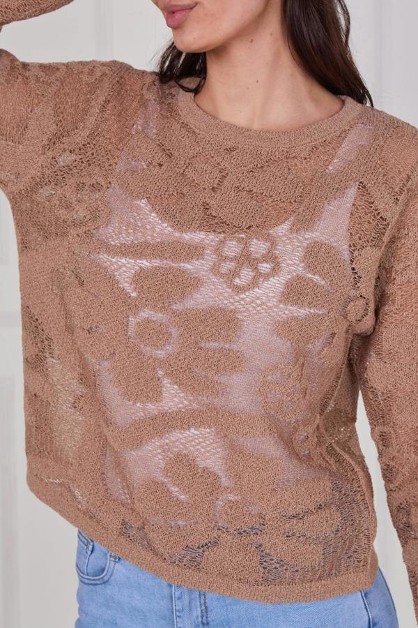 Model wearing a long sleeve crochet top with an open-knit pattern, styled with high-waisted jeans, featuring a relaxed fit and lightweight texture for casual everyday wear.
