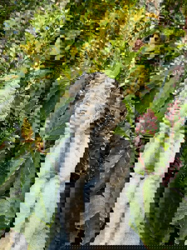 Adorable Stone Cast Boy on Ball Statue