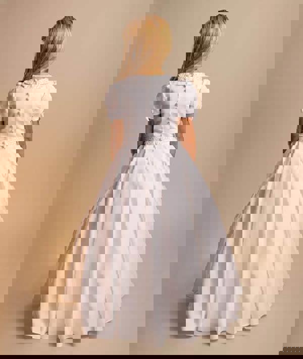 White dress with a belt on a beige background