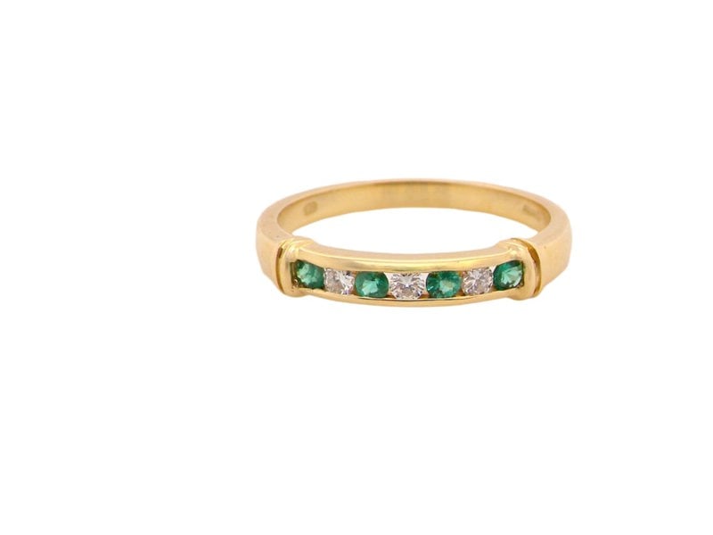 Vintage Tom An 18 carat gold Emerald and Diamond Eternity ring