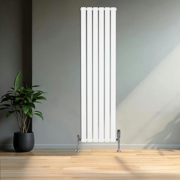 Flat white single column radiator with sleek vertical design, chrome valves, and modern aesthetic, set against a minimalist wall and plant