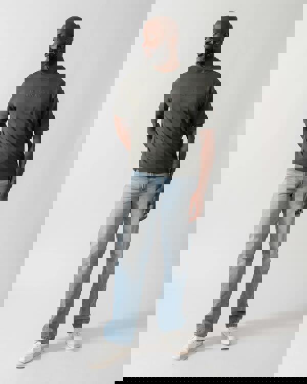 Full length shot of a Model wearing an Armani Exchange Mens T-Shirt with Tonal Milano/New York Logo in Chimera