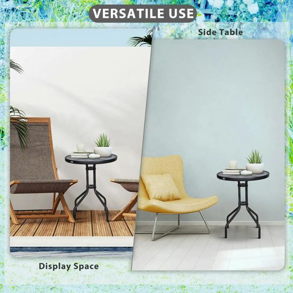 Black round bistro table with tempered glass top and metal tripod legs beside patio seating.