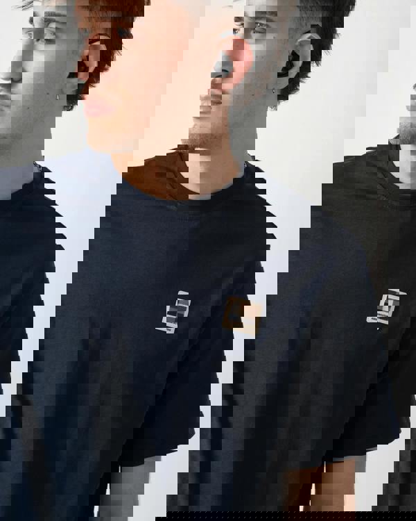 close up shot of a model wearing an Aquascutum Mens Badge T-Shirt in Navy 11