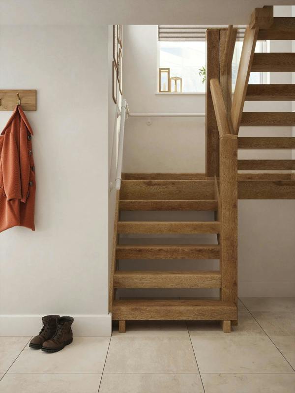 Matt white 40mm half turn handrail installed along hallway staircase wall, front view