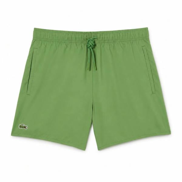 Lacoste lettuce green quick-dry swim shorts with drawstring and crocodile logo.