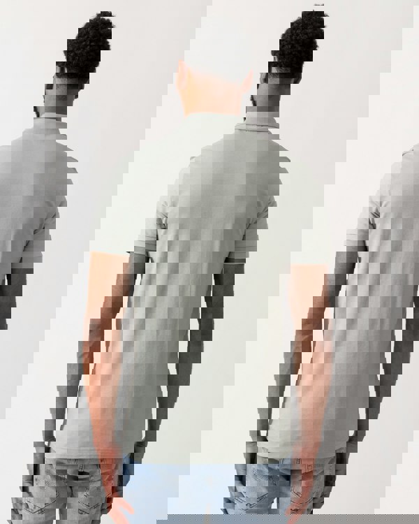 back shot of a Model wearing a BOSS Orange Passenger Mens Stretch-Cotton Slim-Fit Polo Shirt with Logo Patch in Open Green