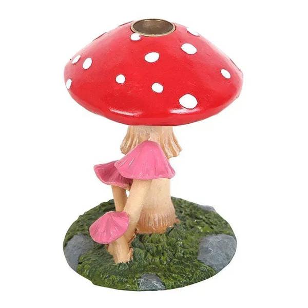 Backflow incense burner shaped like a red polka-dot mushroom with pink side mushrooms