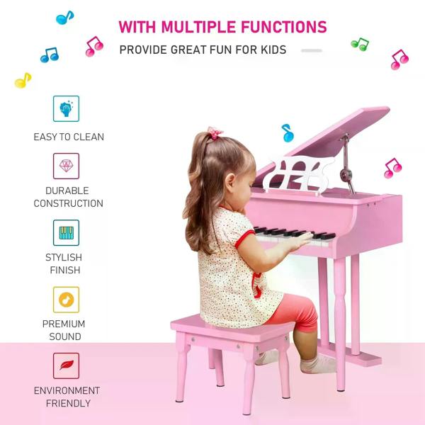 Pink mini kids piano with bench, child playing at the keys